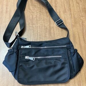 Black Crossbody Bag with Adjustable Strap and Minimalist Design